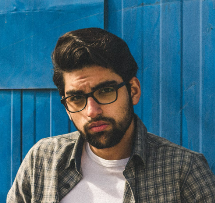 Man with glasses posing